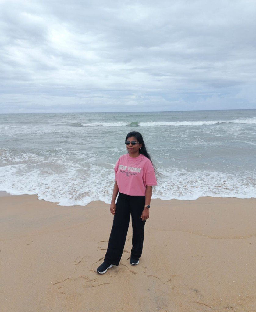 Sivamathi standing on the beach